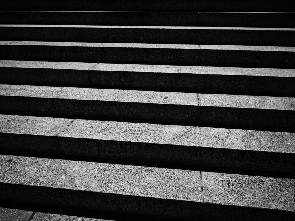 black and white image of concrete steps showing urban architectural design.