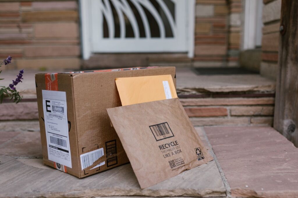 close-up of delivered packages on doorstep, symbolizing online shopping and home delivery.