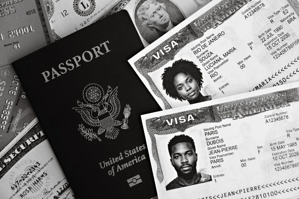 a close-up of us passport with visas and currency, implying travel theme.